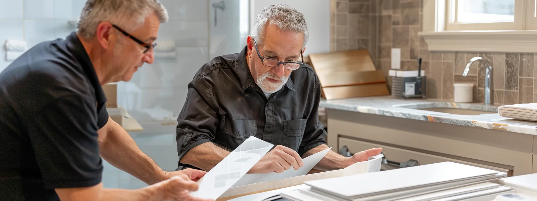 a professional contractor showing a variety of material samples to a homeowner for a bathtub resurfacing project.