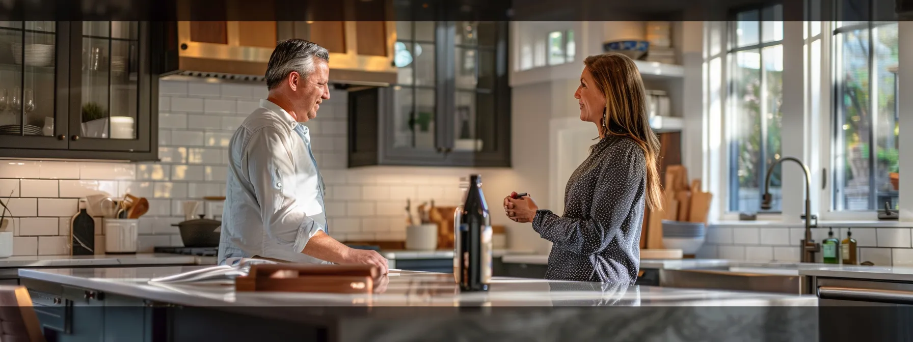 a homeowner discussing with a resurfacing service provider about materials and techniques used for a kitchen project.